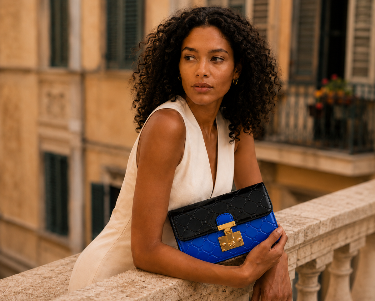 Diamond quilted leather crossbody clutch in blue-and-black