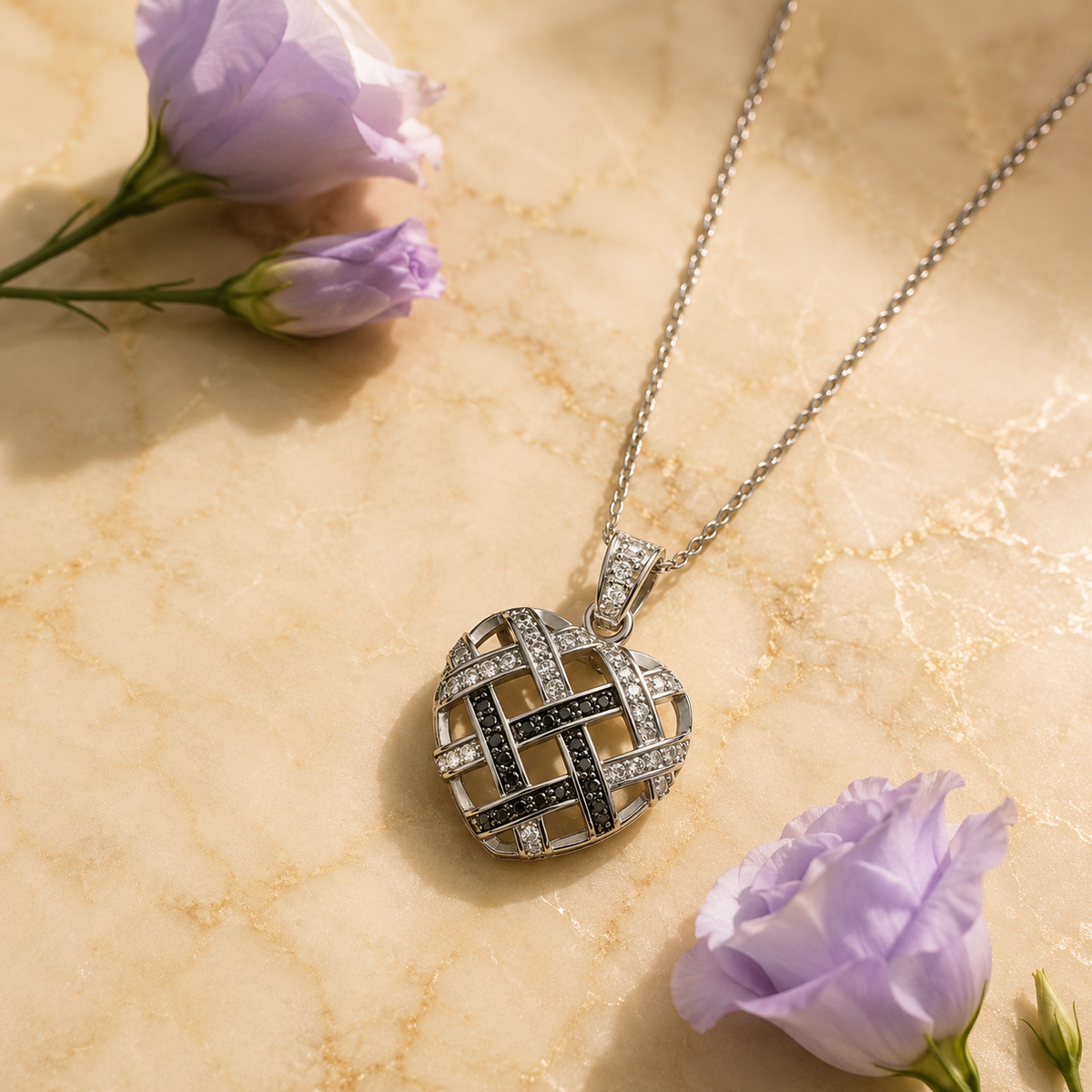 Black and white woven cubic zirconia heart pendant with purple flowers