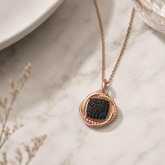 Rose gold and black pavé cubic zirconia drop pendant on marble