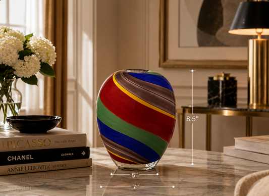 Colorful striped glass vase displayed on a marble table with 8.5 inch height and proportional width measurements.